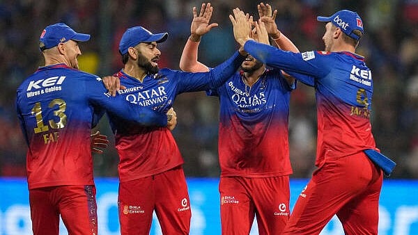 <div class="paragraphs"><p>Royal Challengers Bengaluru's Virat Kohli with teammates celebrates the dismissal of Gujrat Titans batter Shahrukh Khan run out by him during the Indian Premier League (IPL) 2024 T20 cricket match between Royal Challengers Bangalore and Gujrat Titans, at M Chinnaswamy Stadium in Bengaluru, Saturday, May 4, 2024. </p></div>