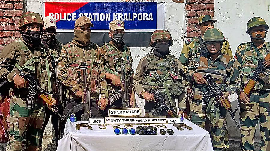 <div class="paragraphs"><p>Kupwara: Security personnel with recovered cache of arms and ammunition at Kralpora, in Kupwara district, Jammu and Kashmir on Thursday, May 16, 2024. </p></div>