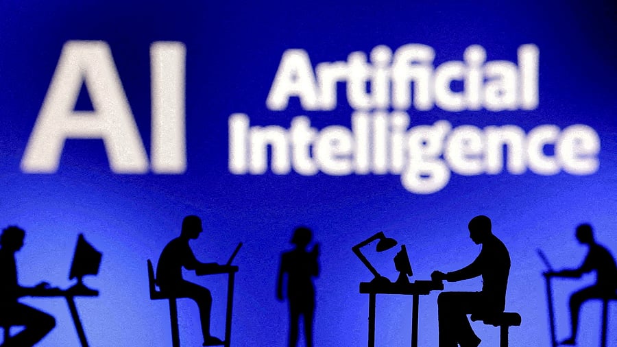 <div class="paragraphs"><p>Figurines with computers and smartphones are seen in front of the words 'Artificial Intelligence AI'.</p></div>