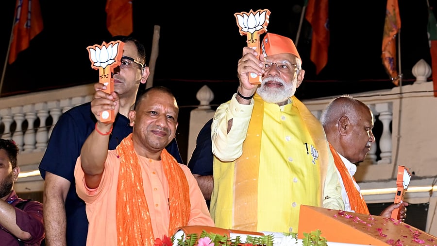 <div class="paragraphs"><p>Prime Minister Narendra Modi with Uttar Pradesh Chief Minister Yogi Adityanath during a roadshow ahead of Lok Sabha elections, in Ayodhya, on Sunday.</p></div>