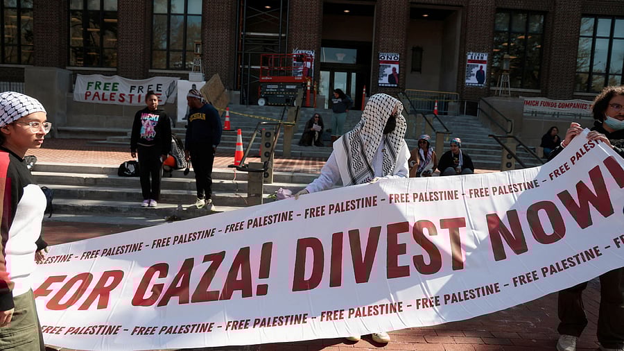 <div class="paragraphs"><p>Protesters hold a banner as a coalition of University of Michigan students camp at an encampment in the Diag to pressure the university to divest its endowment from companies that support Israel or could profit from the ongoing conflict between Israel and Hamas on the University of Michigan college campus in Ann Arbor, Michigan, US, April 25, 2024. </p></div>