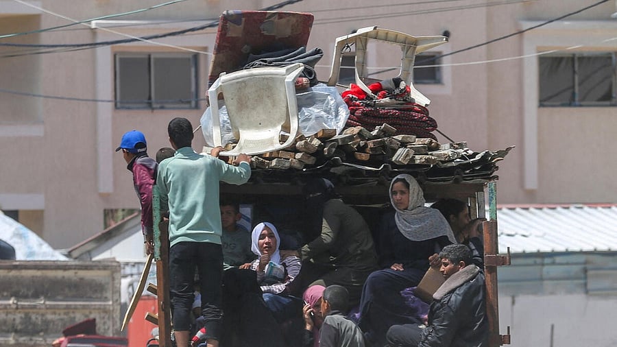 <div class="paragraphs"><p>People flee the eastern parts of Rafah after the Israeli military began evacuating Palestinian civilians ahead of a threatened assault on the southern Gazan city, amid the ongoing conflict between Israel and Hamas, in Rafah.</p></div>
