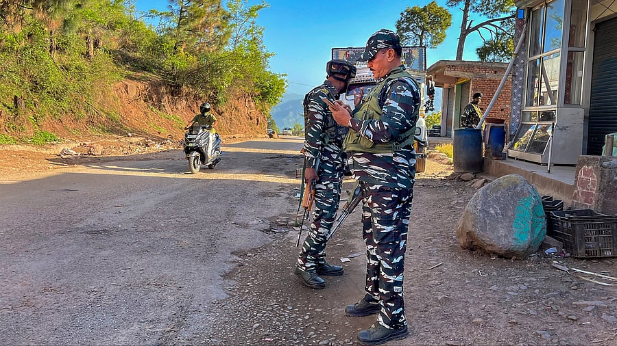 <div class="paragraphs"><p>Poonch: Security personnel stand guard during cordon-and-search-operation after at least one soldier was killed and four were injured as terrorists ambushed an Indian Air Force (IAF) convoy on Saturday, in Pooch district.</p></div>