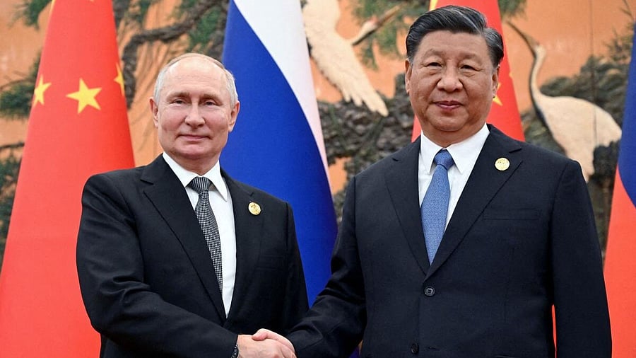 <div class="paragraphs"><p>Russian President Vladimir Putin with Chinese President Xi Jinping. </p></div>