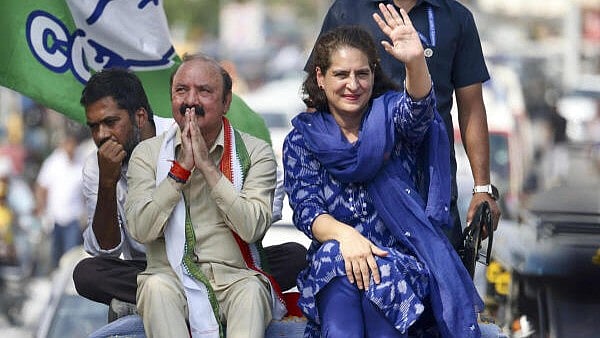<div class="paragraphs"><p>Congress leader Priyanka Gandhi Vadra with the party’s candidate from Amethi constituency Kishori Lal Sharma during an election roadshow for the Lok Sabha polls, in Amethi district.</p></div>