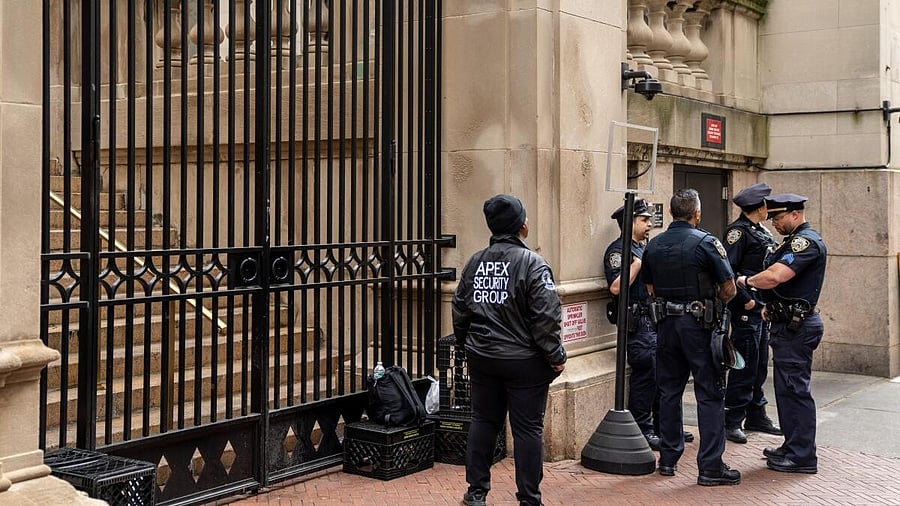 <div class="paragraphs"><p>Private security and NYPD police officers stand guard at the gates of Columbia University in New York City, New York, US, May 2, 2024.</p></div>