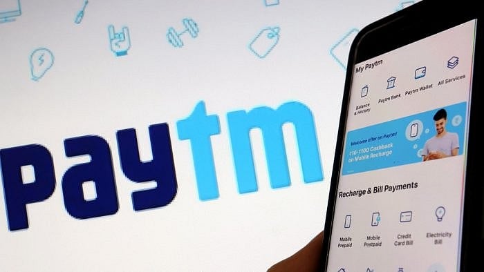 <div class="paragraphs"><p> Paytm logo and a smartphone with the app is seen here. </p></div>