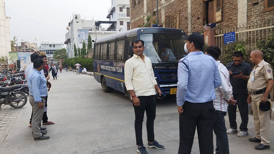 <div class="paragraphs"><p>Security officials at Burari Hospital after it received bomb threat via e-mail, in New Delhi, Sunday.</p></div>