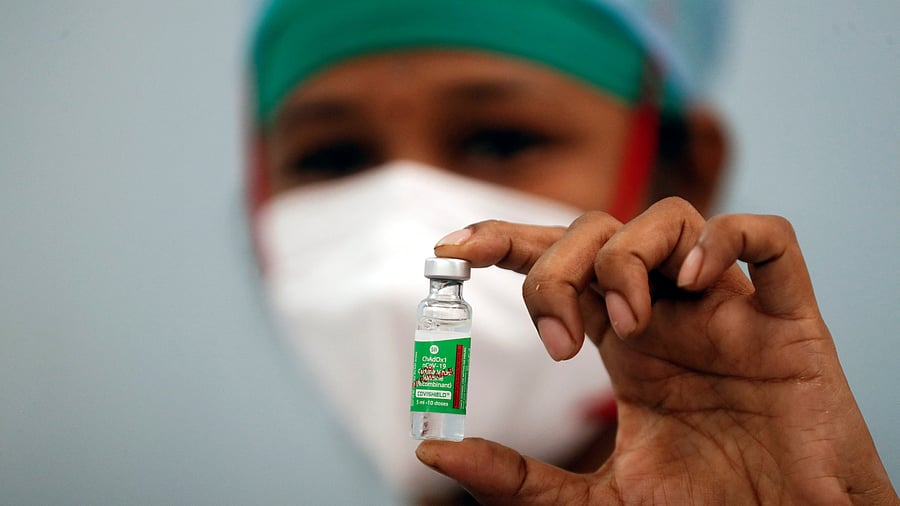 <div class="paragraphs"><p>A nurse displays a vial of AstraZeneca's COVISHIELD vaccine.</p></div>