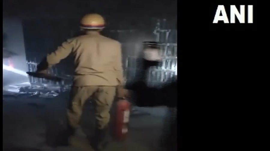 <div class="paragraphs"><p>Screengrab from a video showing firefighters extinguishing the fire.</p></div>