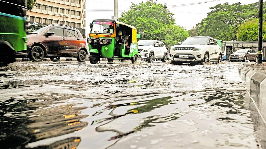 <div class="paragraphs"><p>Vehicles ply on a water logged road in Bengaluru as the city received rainfall on Friday. </p></div>