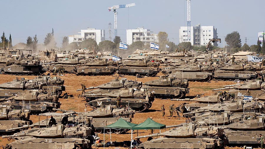 <div class="paragraphs"><p>Israeli soldiers stand next to military vehicles, amid the ongoing conflict between Israel and the Palestinian Islamist group Hamas, near the Israel-Gaza Border, in southern Israel, May 7, 2024. </p></div>