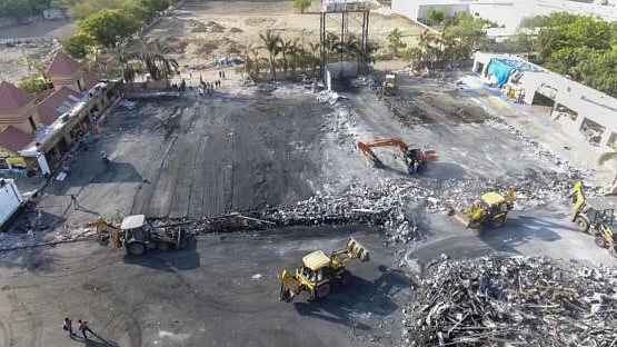 <div class="paragraphs"><p>Debris being removed from the game zone site where a fire broke out on Saturday, in Rajkot, Monday, May 27, 2024. At least 27 people were killed in the fire, according to officials.</p></div>