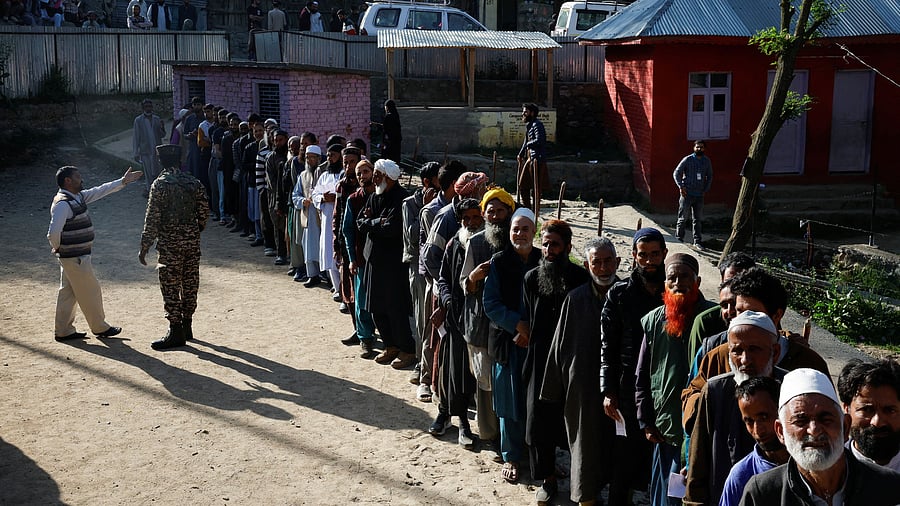<div class="paragraphs"><p>People queue to vote at a polling station during the sixth phase of general election, in south Kashmir's Anantnag district on Saturday.</p></div>