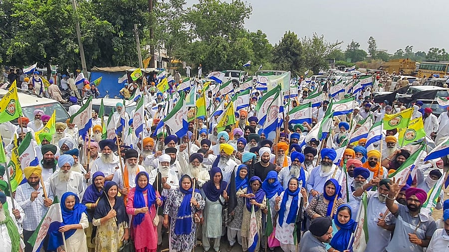 <div class="paragraphs"><p>Farmers stage a protest after they were stopped from marching towards the venue of Prime Minister Narendra Modi's rally for Lok Sabha elections, in Gurdaspur, Friday, May 24, 2024.</p></div>