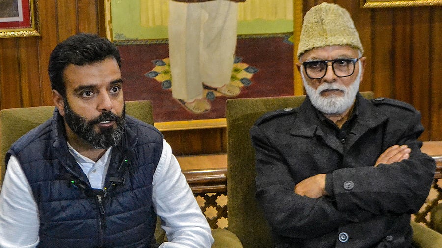 <div class="paragraphs"><p> National Conference leader and candidate from Srinagar constituency Aga Syed Ruhullah Mehdi with the party’s General Secretary Ali Muhammad Sagar during a press conference at the party headquarters, in Srinagar, Sunday.</p></div>