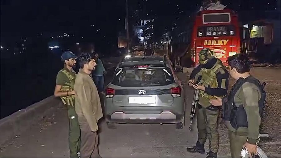 <div class="paragraphs"><p>Security personnel stand guard after a militant attack on army vehicles, in Poonch district, Saturday.</p></div>