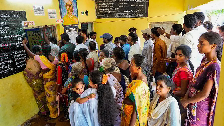 <div class="paragraphs"><p>Voters seen in a queue at a polling station on May 13, 2024.</p></div>