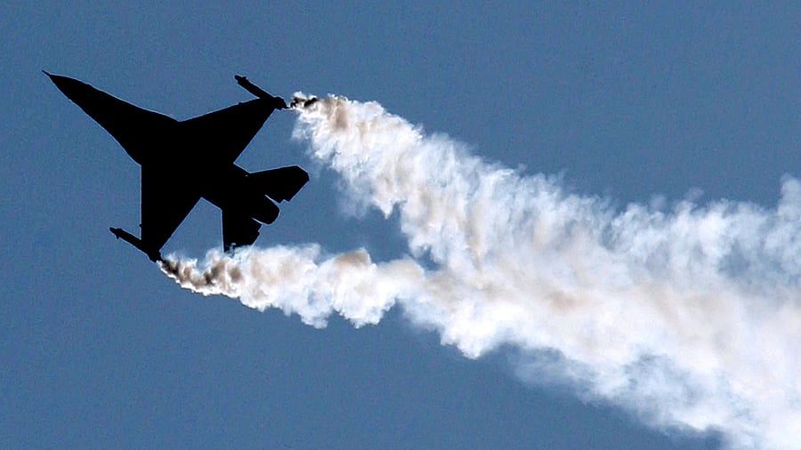 <div class="paragraphs"><p>The silhouette of an F-16 jet.</p></div>