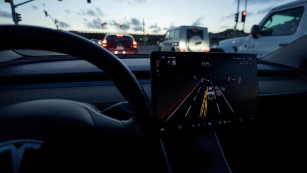 <div class="paragraphs"><p>A Tesla Model 3 vehicle is shown using the Full Self Driving Beta software (FSD) while navigating a city road.</p></div>