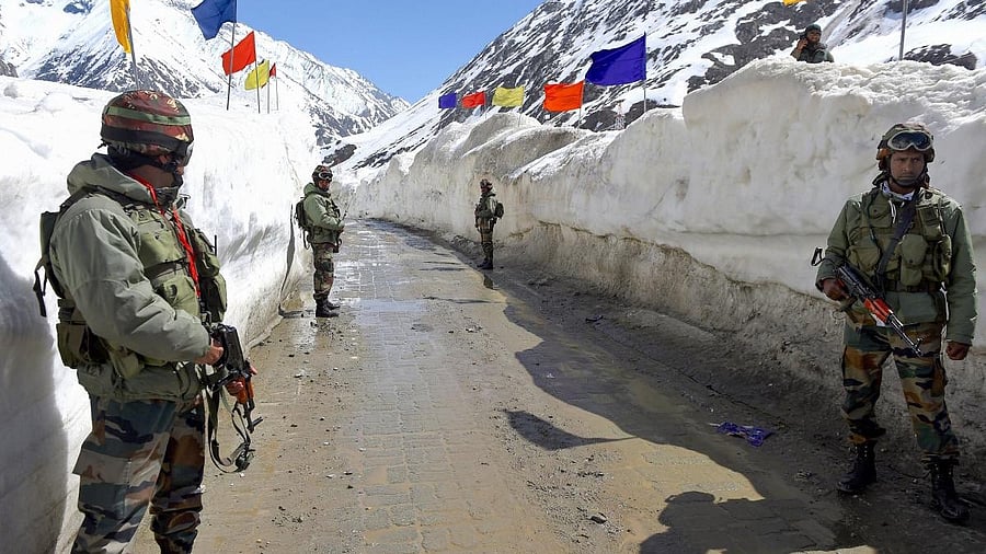 <div class="paragraphs"><p>Representative image showing army soldiers standing guard at snow-bound Zojila Pass, situated at a height of 11,516 feet, on its way to frontier region of Ladakh.</p></div>