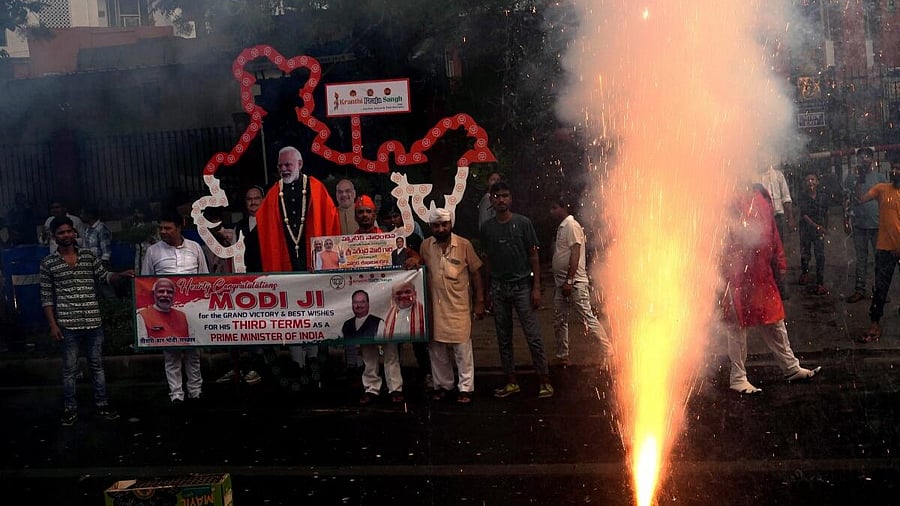 <div class="paragraphs"><p>Supporters celebrate during the arrival of Prime Minister Narendra Modi for a meeting at BJP headquarters. </p></div>