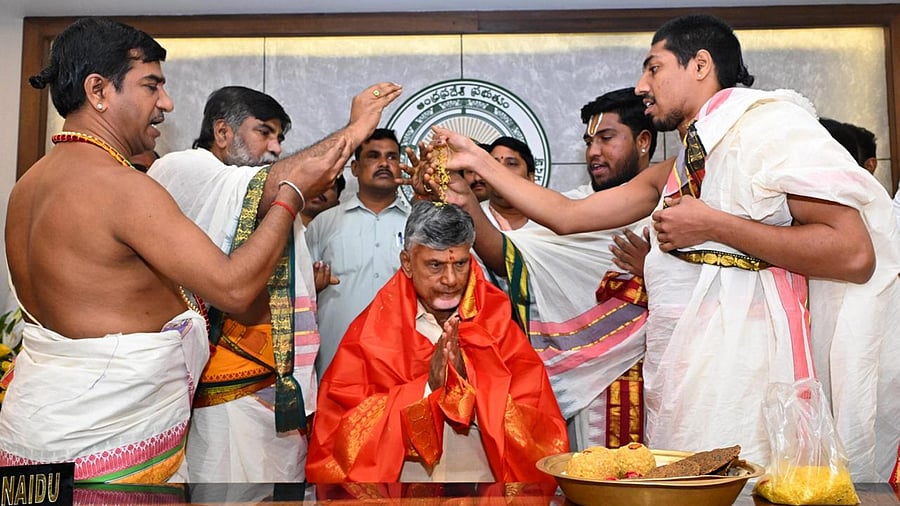 <div class="paragraphs"><p>Andhra Pradesh Chief Minister Nara Chandrababu Naidu takes part in a prayer ceremony before taking charge at his office at Tadepalli, Amaravati, Thursday.</p></div>