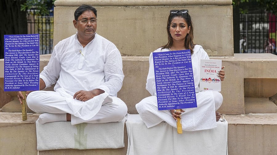 <div class="paragraphs"><p>Newly elected TMC MLAs Rayat Hossain Sarkar and Sayantika Banerjee wait for the second consecutive day on the West Bengal Legislative Assembly premises for their swearing-in ceremony, in Kolkata.</p></div>