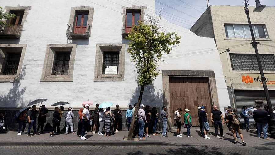 <div class="paragraphs"><p>People wait in line to vote at a polling station during the general election, in Mexico City.</p></div>