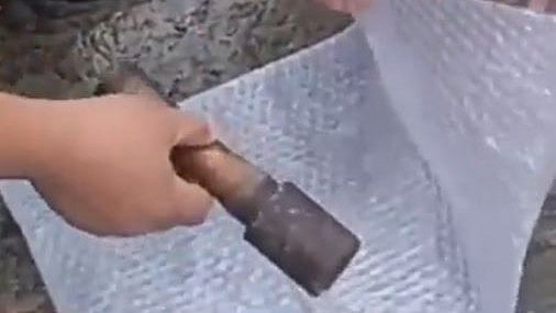 <div class="paragraphs"><p>Screengrab from a video showing the hand grenade being confiscated.</p></div>