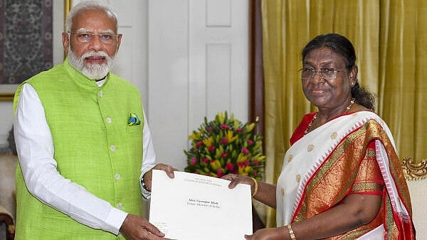 <div class="paragraphs"><p>Prime Minister Narendra Modi tenders his resignation letter to President Droupadi Murmu as the 17th Lok Sabha comes to an end, at Rashtrapati Bhavan, in New Delhi.</p></div>