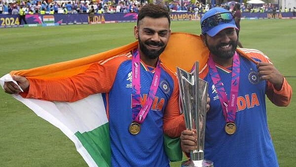 <div class="paragraphs"><p>Indian skipper Rohit Sharma seen here with teammate Virat Kohli pose with the winners trophy after defeating South Africa in the ICC Men's T20 World Cup final cricket match at Kensington Oval in Bridgetown, Barbados, Saturday, June 29, 2024. Both cricketers have announced their decision to quit the T20 Internationals format.</p></div>