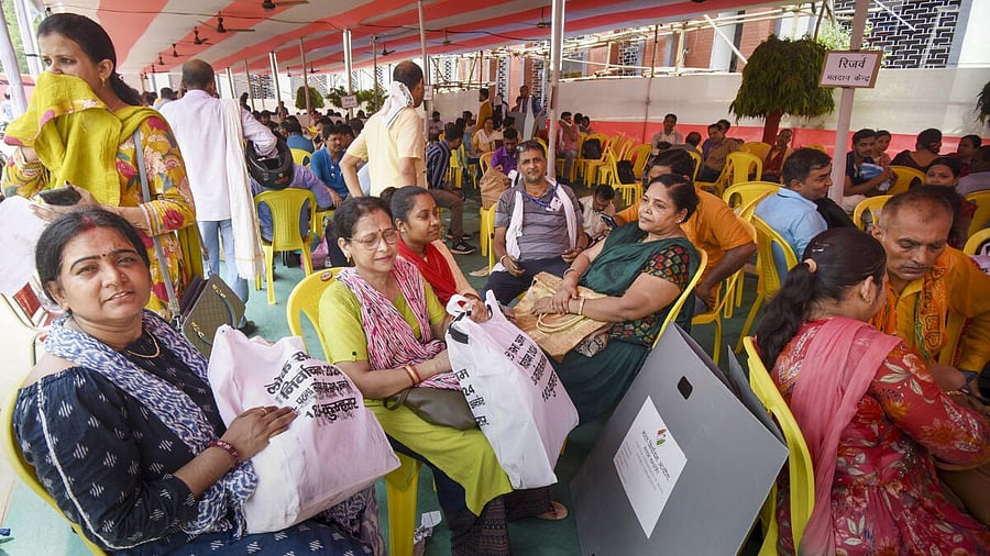 <div class="paragraphs"><p>Poll officials collect election material for the last phase of Lok Sabha polls, in Patna</p></div>