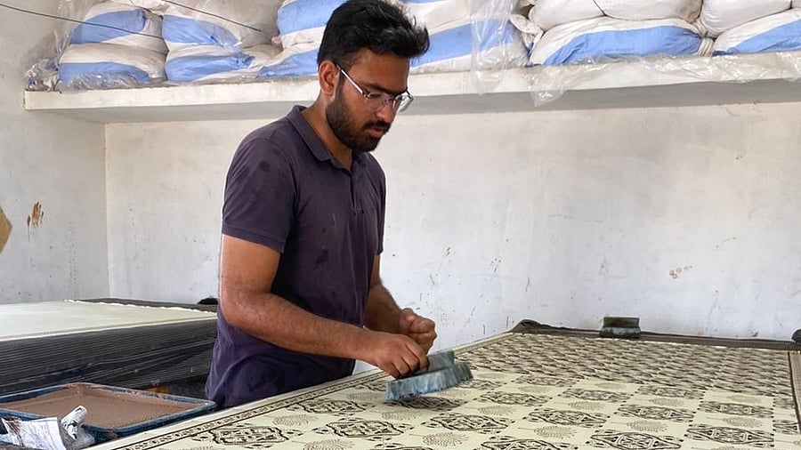 <div class="paragraphs"><p>Artist Sahil Khatri printing colours on outlined motifs. </p></div>