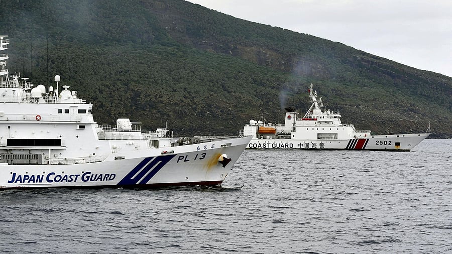 <div class="paragraphs"><p>A China Coast Guard vessel No.2502 sails near a Japan Coast Guard vessel Motobu off Uotsuri Island, one of a group of disputed islands called Senkaku Islands in Japan, also known in China as Diaoyu Islands, in the East China Sea. </p></div>