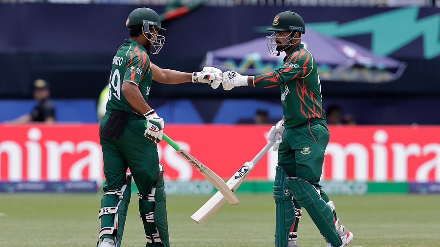 <div class="paragraphs"><p>File photo of Bangladesh's captain Najmul Hossain Shanto, left, fist bumps with batting partner Litton Das.</p></div>