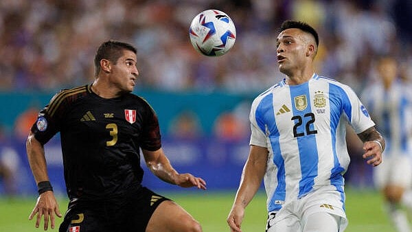 <div class="paragraphs"><p>Argentina forward Lautaro Martínez  controls the ball from Peru defender Aldo Corzo in the second half during the Copa America group stage at Hard Rock Stadium.</p></div>