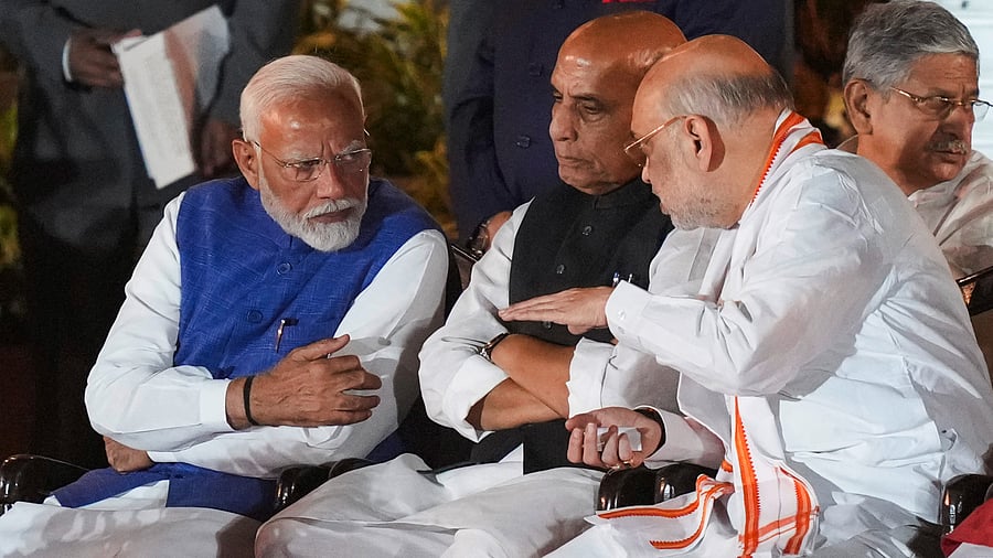 <div class="paragraphs"><p>File photo of Prime Minister-designate Narendra Modi with MP-elects Rajnath Singh and Amit Shah.</p></div>