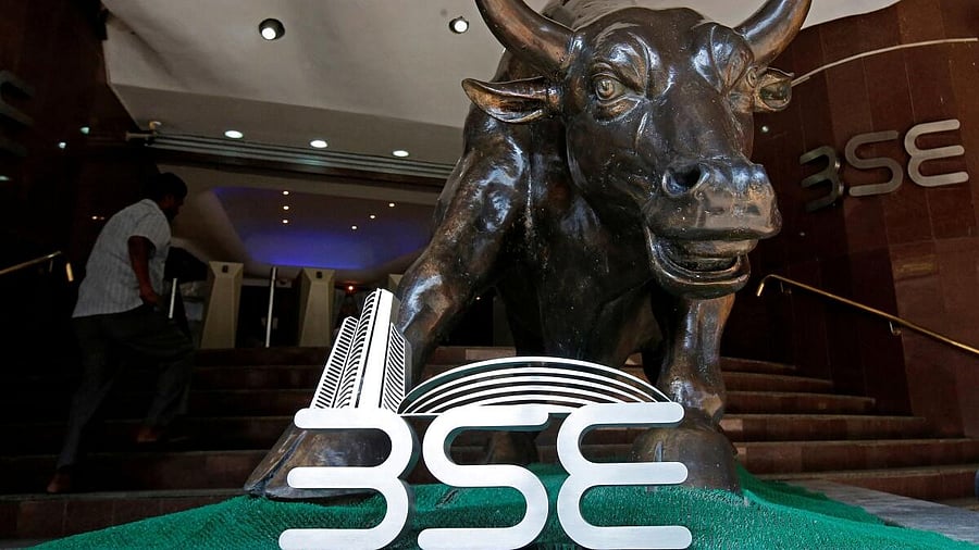 <div class="paragraphs"><p>The Bombay Stock Exchange (BSE) logo is seen under a bull statue at the entrance of their building in Mumbai</p></div>