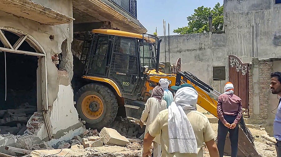 <div class="paragraphs"><p>File photo of a bulldozer being used to demolish the allegedly illegally constructed house. (Representative image)</p></div>