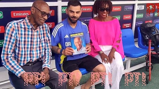 <div class="paragraphs"><p> Wesley Hall and Virat Kohli</p></div>