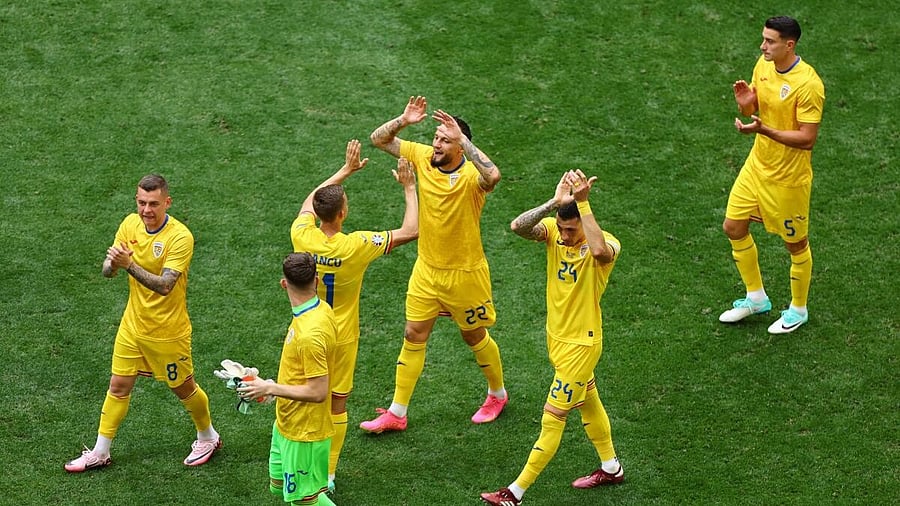 <div class="paragraphs"><p>Romanian players celebrate their win over Ukraine. </p></div>