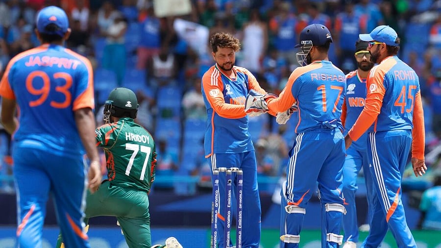 <div class="paragraphs"><p>India's bowler Kuldeep Yadav with teammates during the ICC Men's T20 World Cup cricket match between India and Bangladesh, at Sir Vivian Richards Stadium in North Sound, Antigua and Barbuda, Saturday, June 22, 2024.</p></div>