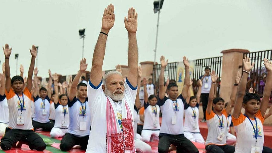 <div class="paragraphs"><p>File Photo of&nbsp; Prime Minister Narendra Modi performing yoga along with thousands of others during a mass yoga event.</p></div>