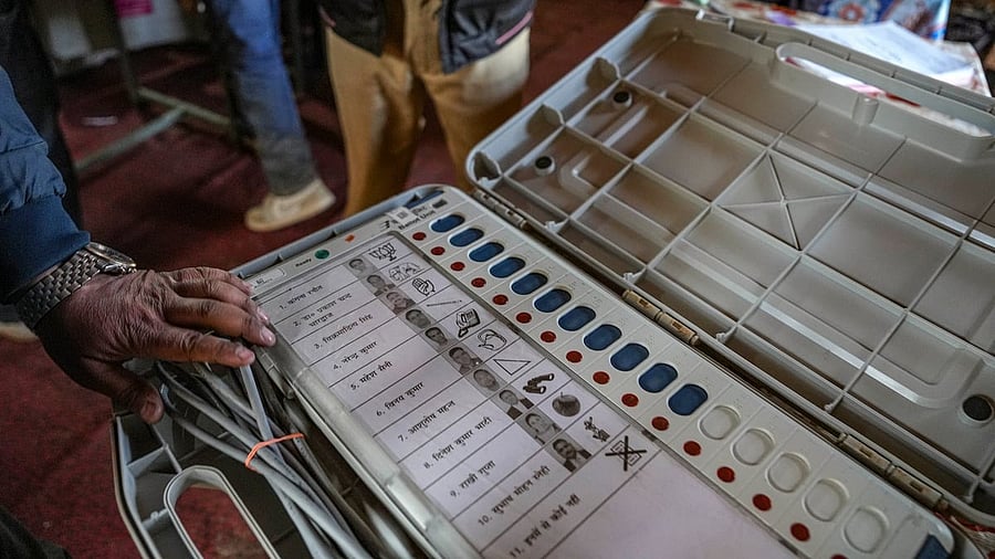 <div class="paragraphs"><p>Election officials seal an Electronic Voting Machine (EVM).</p></div>