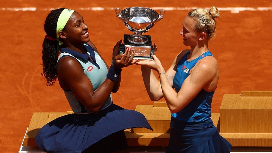 <div class="paragraphs"><p>Coco Gauff of the U.S. and Czech Republic's Katerina Siniakova pose with their trophy after winning the women's doubles final against Italy's Sara Errani and Jasmine Paolini.</p></div>