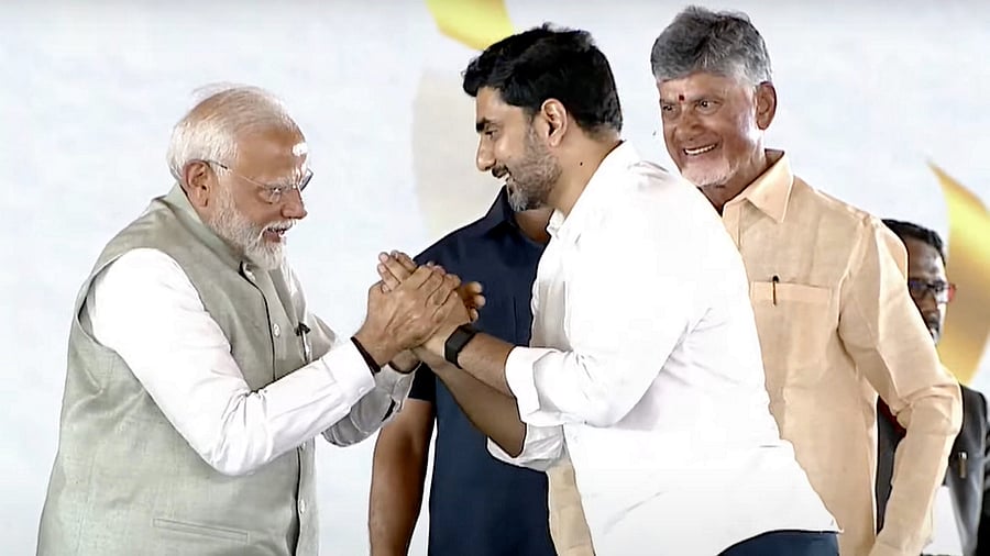 <div class="paragraphs"><p>Prime Minister Narendra Modi with Nara Lokesh as Andhra Pradesh CM Nara Chandrababu Naidu looks on</p></div>