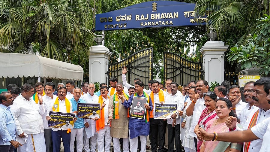 <div class="paragraphs"><p>Opposition leader in Assembly R Ashoka, BJP State President B Y Vijayendra and party MLAs and MPs during a protest march outside Raj Bhavan over the Karnataka Maharshi Valmiki Scheduled Tribe Development Corporation to corporates.</p></div>
