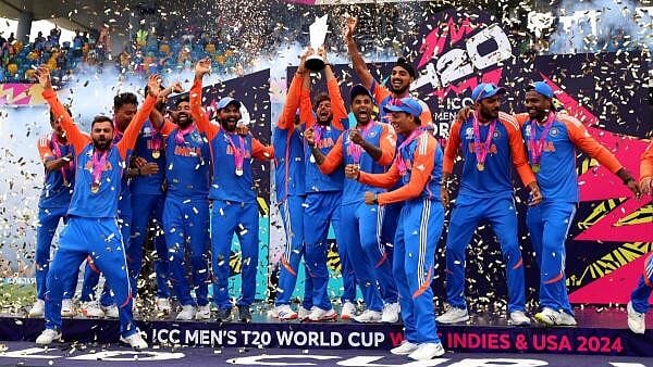<div class="paragraphs"><p>India's Kuldeep Yadav lifts the trophy as they celebrate after winning the T20 World Cup.</p></div>
