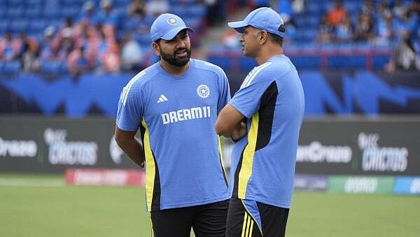 <div class="paragraphs"><p>Indian team head coach Rahul Dravid, right, speaks to captain Rohit Sharma ahead of the ICC Men's T20 World Cup cricket match between Canada and India at the Central Broward Regional Park Stadium, Lauderhill. </p></div>